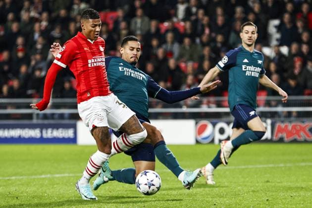 EINDHOVEN - (l-r) Patrick van Aanholt of PSV Eindhoven, William Saliba of Arsenal FC during the UEFA Champions League group B match between PSV Eindhoven and Arsenal FC at the Phillips stadium on December 12, 2023 in Eindhoven, Netherlands. ANP MAURICE VAN STEEN UEFA Champions League 2023 24 2023 2024 xVIxANPxSportx xxANPxIVx 486126018 originalFilename: 486126018.jpg