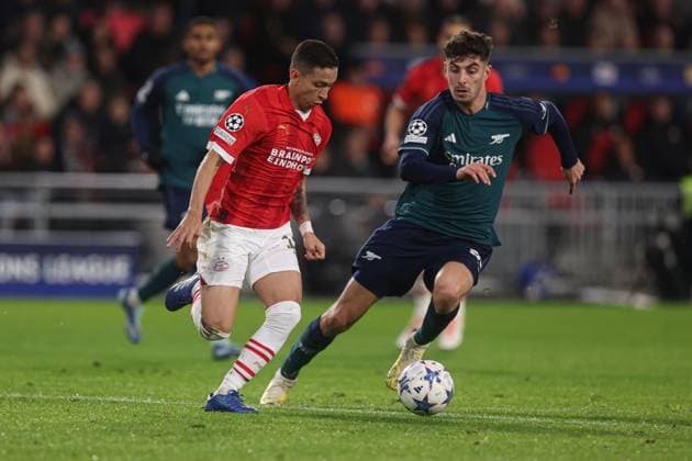 Mauro Junior of PSV Eindhoven and Kai Havertz of Arsenal PSV Eindhoven v Arsenal, UEFA Champions League, Group B, Football, Philips Stadion, Eindhoven, Netherlands - 12 Dec 2023 EDITORIAL USE ONLY No use with unauthorised audio, video, data, fixture lists, club league logos or live services. Online in-match use limited to 120 images, no video emulation. No use in betting, games or single club league player publications. Copyright: xPaulxCurrie Shutterstockx 14254183am