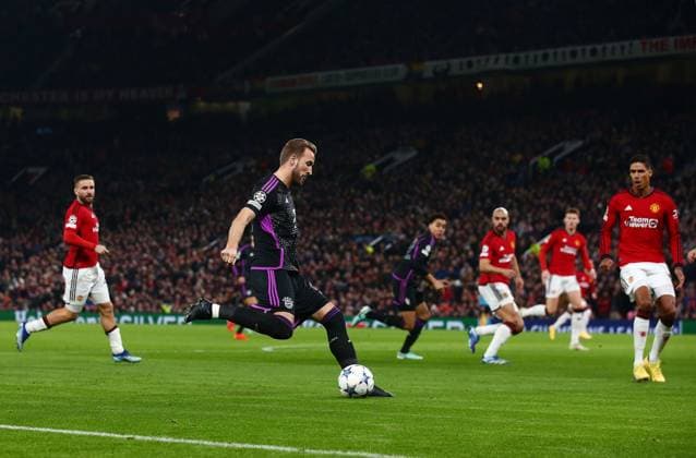 Harry Kane of Bayern Munich on the ball Manchester United, ManU v Bayern Munich, UEFA Champions League, Group A, Football, Old Trafford, Manchester, UK - 12 Dec 2023 EDITORIAL USE ONLY No use with unauthorised audio, video, data, fixture lists, club league logos or live services. Online in-match use limited to 120 images, no video emulation. No use in betting, games or single club league player publications. Copyright: xMattxWest Shutterstockx 14254194r