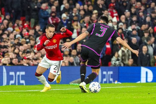 Manchester United, ManU v Bayern Munich Champions League 12 12 2023. Antony (21) of Manchester United goes past Kim Min-Jae (3) of Bayern Munich during the Champions League match between Manchester United and Bayern Munich at Old Trafford, Manchester, England on 12 December 2023. Editorial use only , Copyright: xNigelxKeenex PSI-18580-0020
