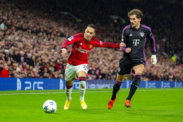 Manchester United, ManU v Bayern Munich Champions League 12 12 2023. Antony (21) of Manchester United holds off Leon Goretzka (8) of Bayern Munich during the Champions League match between Manchester United and Bayern Munich at Old Trafford, Manchester, England on 12 December 2023. Editorial use only , Copyright: xNigelxKeenex PSI-18580-0022