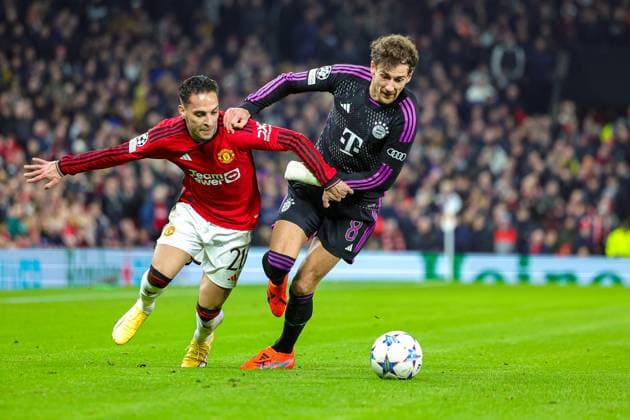 Manchester United, ManU v Bayern Munich Champions League 12 12 2023. Antony (21) of Manchester United holds off Leon Goretzka (8) of Bayern Munich during the Champions League match between Manchester United and Bayern Munich at Old Trafford, Manchester, England on 12 December 2023. Editorial use only , Copyright: xNigelxKeenex PSI-18580-0023