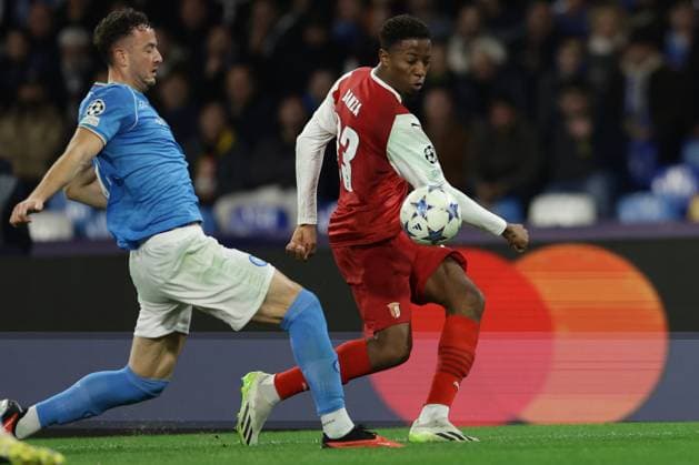 SSC Napoli s Kossovari defender Amir Rrahmani challenges for the ball with BragaÃ¢& x80;& x99;s French forward Simon Banza during the Uefa champions league match between SSC Napoli vs Braga at the Diego Armando Maradona Stadium in Naples, southern Italy, on December 12, 2023.  Copyright: xAntonioxBalasco IPAxSportx xipa-x xx IPA_42176160 IPA_Agency_IPA42176160