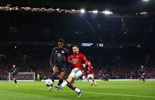 Luke Shaw of Manchester United, ManU challenges Kingsley Coman of Bayern Munich Manchester United v Bayern Munich, UEFA Champions League, Group A, Football, Old Trafford, Manchester, UK - 12 Dec 2023 EDITORIAL USE ONLY No use with unauthorised audio, video, data, fixture lists, club league logos or live services. Online in-match use limited to 120 images, no video emulation. No use in betting, games or single club league player publications. Copyright: xMattxWest Shutterstockx 14254194af