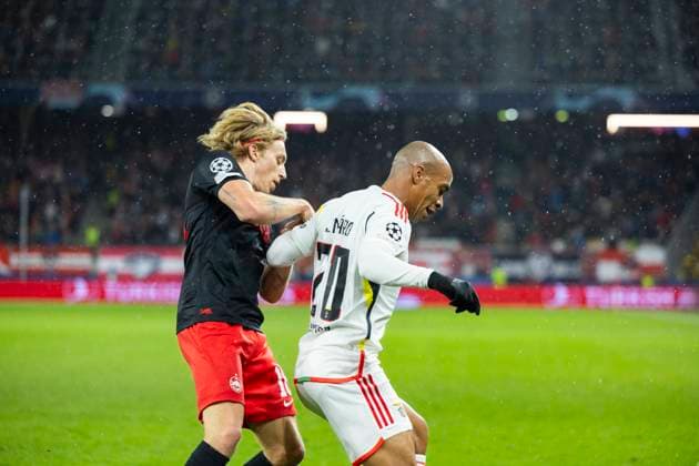 SOCCER - UEFA CL, RBS vs Benfica SALZBURG,AUSTRIA,12.DEC.23 - SOCCER - UEFA Champions League, group stage, Red Bull Salzburg vs SL Benfica. Image shows Mads Bidstrup (RBS) and Joao Mario (Benfica).  GEPAxpictures xGintarexKarpaviciute