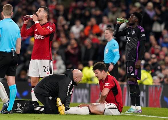 Manchester, England, 12th December 2023. Harry Maguire of Manchester United, ManU goes down with an injury during the UEFA Champions League match at Old Trafford, Manchester. Picture credit should read: Andrew Yates Sportimage EDITORIAL USE ONLY. No use with unauthorised audio, video, data, fixture lists, club league logos or live services. Online in-match use limited to 120 images, no video emulation. No use in betting, games or single club league player publications. SPI-2800-0025