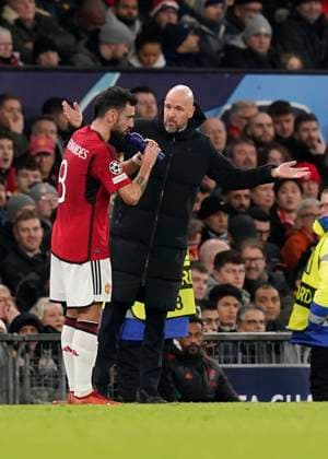Manchester, England, 12th December 2023. Erik ten Hag manager of Manchester United, ManU talks tactics with Bruno Fernandes of Manchester United during the UEFA Champions League match at Old Trafford, Manchester. Picture credit should read: Andrew Yates Sportimage EDITORIAL USE ONLY. No use with unauthorised audio, video, data, fixture lists, club league logos or live services. Online in-match use limited to 120 images, no video emulation. No use in betting, games or single club league player publications. SPI-2800-0028