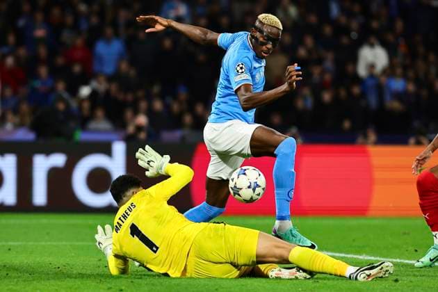 Victor Osimhen of SSC Napoli past Matheus Lima Magalhaes of SC Braga and scores the goal of 2-0 during the Champions League Group C football match between SSC Napoli and SC Braga at Diego Armando Maradona stadium in Naples (Italy), December 12th, 2023. cesarexpurini