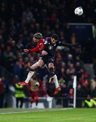 Sport Bilder des Tages Alejandro Garnacho of Manchester United, ManU challenges Noussair Mazraoui of Bayern Munich to a header Manchester United v Bayern Munich, UEFA Champions League, Group A, Football, Old Trafford, Manchester, UK - 12 Dec 2023 EDITORIAL USE ONLY No use with unauthorised audio, video, data, fixture lists, club league logos or live services. Online in-match use limited to 120 images, no video emulation. No use in betting, games or single club league player publications. Copyright: xMattxWest Shutterstockx 14254194ap