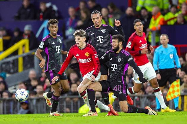 Manchester United, ManU v Bayern Munich Champions League 12 12 2023. Noussair Mazraoui (40) of Bayern Munich brings down Alejandro Garnacho (17) of Manchester United during the Champions League match between Manchester United and Bayern Munich at Old Trafford, Manchester, England on 12 December 2023. Editorial use only , Copyright: xNigelxKeenex PSI-18580-0036