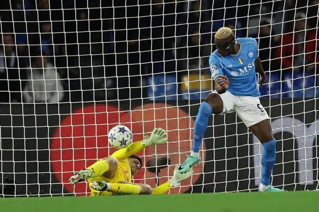 SSC Napoli s Nigerian forward Victor Osimhen scores against Braga s Brazilian goalkeeper Matheus Magalhaes during the Uefa champions league match between SSC Napoli vs Braga at the Diego Armando Maradona Stadium in Naples, southern Italy, on December 12, 2023.  Copyright: xAntonioxBalasco IPAxSportx xipa-x xx IPA_42176710 IPA_Agency_IPA42176710
