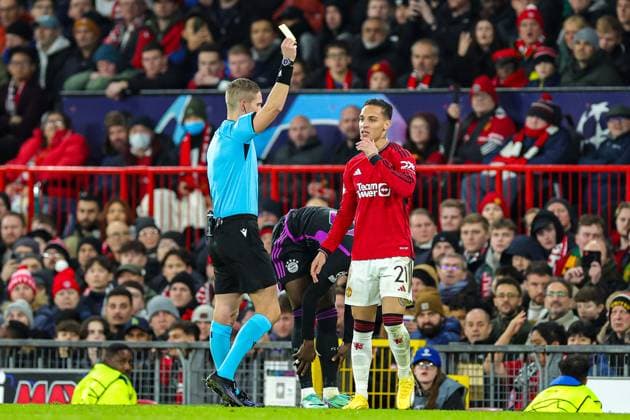 Manchester United, ManU v Bayern Munich Champions League 12 12 2023. Antony (21) of Manchester United gets a yellow card during the Champions League match between Manchester United and Bayern Munich at Old Trafford, Manchester, England on 12 December 2023. Editorial use only , Copyright: xNigelxKeenex PSI-18580-0046