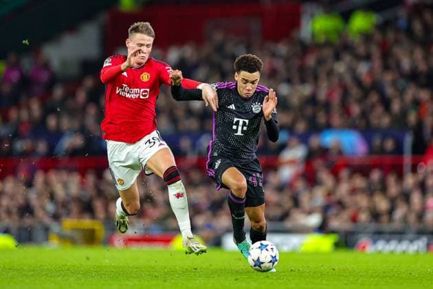 Manchester United, ManU v Bayern Munich Champions League 12 12 2023. Scott McTominay (39) of Manchester United tussles with Jamal Musiala (42) of Bayern Munich during the Champions League match between Manchester United and Bayern Munich at Old Trafford, Manchester, England on 12 December 2023. Editorial use only , Copyright: xNigelxKeenex PSI-18580-0052