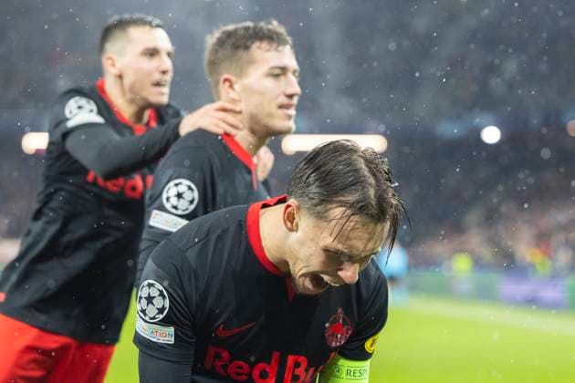 SOCCER - UEFA CL, RBS vs Benfica SALZBURG,AUSTRIA,12.DEC.23 - SOCCER - UEFA Champions League, group stage, Red Bull Salzburg vs SL Benfica. Image shows the rejoicing of Oscar Gloukh, Luka Sucic and Amar Dedic (RBS).  GEPAxpictures xGintarexKarpaviciute