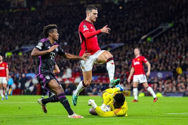 Manchester United, ManU v Bayern Munich Champions League 12 12 2023. Andre Onana (24) of Manchester United comes out to stop the ball during the Champions League match between Manchester United and Bayern Munich at Old Trafford, Manchester, England on 12 December 2023. Editorial use only , Copyright: xNigelxKeenex PSI-18580-0053