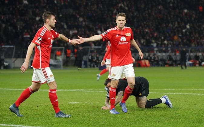 Robin Knoche and Paul Jaeckel high-five Sports Football Soccer UEFA Champions League UCL Men 6 Matchday Season 2023 2024 12 12 2023 1 FC Union Berlin FCU vs Real Madrid Olympiastadion DFL regulations prohibit any use of photographs as image sequences and or quasi video