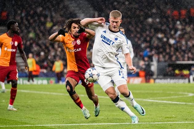 231212 Sacha Boey of Galatasaray and Andreas Cornelius of FC Copenhagen during the UEFA Champions League football match between FC Copenhagen and Galatasaray on December 12, 2023 in Copenhagen Photo Petter Arvidson BILDBYRAN kod PA PA0704 fotboll football soccer fotball champions league fc copenhagen galatasaray bbeng  Copyright: PETTERxARVIDSON BB231212PA097