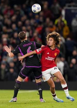 Manchester, England, 12th December 2023. Joshua Kimmich of Bayern Munich tussles with Hannibal Mejbri of Manchester United, ManU during the UEFA Champions League match at Old Trafford, Manchester. Picture credit should read: Andrew Yates Sportimage EDITORIAL USE ONLY. No use with unauthorised audio, video, data, fixture lists, club league logos or live services. Online in-match use limited to 120 images, no video emulation. No use in betting, games or single club league player publications. SPI-2800-0046