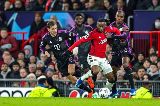 Manchester United, ManU v Bayern Munich Champions League 12 12 2023. Mathys Tel (39) of Bayern Munich tussles with Aaron Wan-Bissaka (29) of Manchester United during the Champions League match between Manchester United and Bayern Munich at Old Trafford, Manchester, England on 12 December 2023. Editorial use only , Copyright: xNigelxKeenex PSI-18580-0065