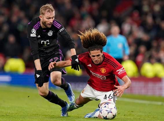 Manchester, England, 12th December 2023. Konrad Laimer of Bayern Munich (L) challenges Hannibal Mejbri of Manchester United, ManU during the UEFA Champions League match at Old Trafford, Manchester. Picture credit should read: Andrew Yates Sportimage EDITORIAL USE ONLY. No use with unauthorised audio, video, data, fixture lists, club league logos or live services. Online in-match use limited to 120 images, no video emulation. No use in betting, games or single club league player publications. SPI-2800-0123