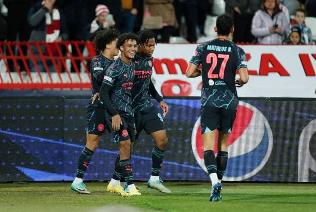 Micah Hamilton of Manchester City celebrates scoring a goal to make it 0-1 with their team mates Crvena zvezda v Manchester City, UEFA Champions League, Group G, Football, Rajko Mitic Stadium, Belgrade, Serbia - 13 Dec 2023 EDITORIAL USE ONLY No use with unauthorised audio, video, data, fixture lists, club league logos or live services. Online in-match use limited to 120 images, no video emulation. No use in betting, games or single club league player publications. Copyright: xNikolaxKrstic Shutterstockx 14254230aq