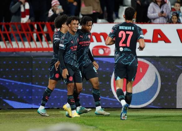 Micah Hamilton of Manchester City celebrates scoring a goal to make it 0-1 with their team mates Crvena zvezda v Manchester City, UEFA Champions League, Group G, Football, Rajko Mitic Stadium, Belgrade, Serbia - 13 Dec 2023 EDITORIAL USE ONLY No use with unauthorised audio, video, data, fixture lists, club league logos or live services. Online in-match use limited to 120 images, no video emulation. No use in betting, games or single club league player publications. Copyright: xNikolaxKrstic Shutterstockx 14254230ar