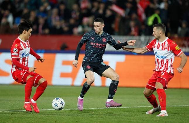 Phil Foden of Manchester City passes the ball Crvena zvezda v Manchester City, UEFA Champions League, Group G, Football, Rajko Mitic Stadium, Belgrade, Serbia - 13 Dec 2023 EDITORIAL USE ONLY No use with unauthorised audio, video, data, fixture lists, club league logos or live services. Online in-match use limited to 120 images, no video emulation. No use in betting, games or single club league player publications. Copyright: xNikolaxKrstic Shutterstockx 14254230bp