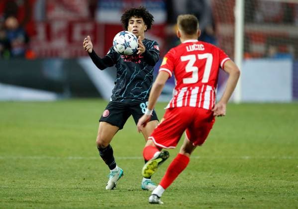 Rico Lewis of Manchester City controls the ball whilst being pressured by Vladimir Lucic of Red Star Crvena zvezda v Manchester City, UEFA Champions League, Group G, Football, Rajko Mitic Stadium, Belgrade, Serbia - 13 Dec 2023 EDITORIAL USE ONLY No use with unauthorised audio, video, data, fixture lists, club league logos or live services. Online in-match use limited to 120 images, no video emulation. No use in betting, games or single club league player publications. Copyright: xNikolaxKrstic Shutterstockx 14254230ct