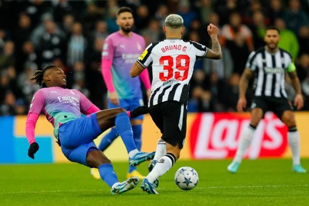 13th December 2023; St James Park, Newcastle, England; UEFA Champions League Football, Newcastle United versus AC Milan; Rafael Leao of AC Milan loses out in a tackle to Bruno Guimaraes of Newcastle United  ActionPlus12585477 GrahamxWilson