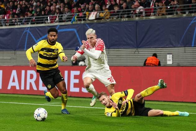 Benjamin Sesko RB Leipzig,30 vs Saidy Janko BSC Young Boys Bern,17 and Fabian Lustenberger BSC Young Boys Bern,28 Champions League Season 2023 2024 Group G RB Leipzig vs BSC Young Boys Bern at the Red Bull Arena in Leipzig Action,Football,Germany,Man,Men,13 12 2023