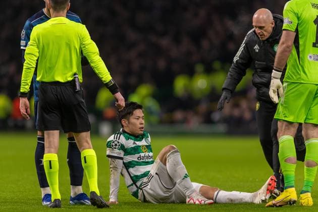 Celtic v Feyenoord Champions League 13 12 2023. Tomoki Iwata of Celtic FC picks up an injury and has to leave the pitch during the Champions League Matchday 6, Celtic FC vs Feyenoord, Celtic Park, Parkhead, Glasgow, 13 12 2023. Editorial use only , Copyright: xColinxPoultneyx PSI-18592-0012