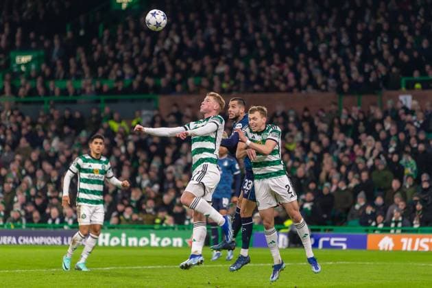 Celtic v Feyenoord Champions League 13 12 2023. Alistair Johnston of Celtic FC challenges Dávid Hancko of Feyenoord in the air during the Champions League Matchday 6, Celtic FC vs Feyenoord, Celtic Park, Parkhead, Glasgow, 13 12 2023. Editorial use only , Copyright: xColinxPoultneyx PSI-18592-0025
