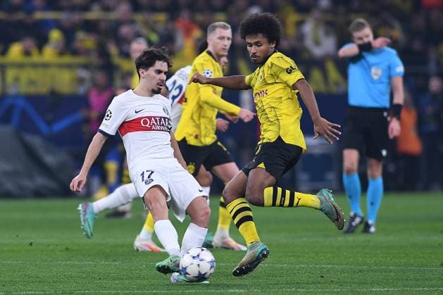 Soccer Champions League group stage matchday 6 Borussia Dortmund Paris Saint Germain on 13 12 2023 at Signal Iduna Park in Dortmund Vitinha Paris , left Karim Adeyemi Dortmund , right xRx