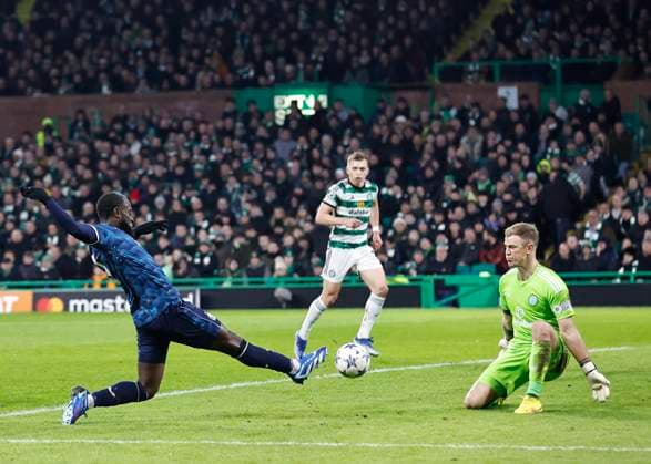 Celtic v Feyenoord Rotterdam UEFA Champions League Lutsharel Geertruida of Feyenoord Rotterdam (left) stretches to get a shot as Joe Hart of Celtic (right) gets ready to block during the UEFA Champions League Group E match at Celtic Park, Glasgow Copyright: xFredxPalmerx FIL-19372-0041 UK Newspapers OUT