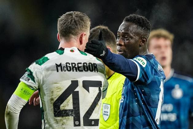 UEFA Champions League: Celtic v Feyenoord Glasgow - Callum McGregor of Celtic, Yankuba Minteh of Feyenoord during the 6th leg of the UEFA Champions League group stage between Celtic v Feyenoord at Celtic Park on 13 December 2023 in Glasgow, Scotland. Copyright: xTomxBodex