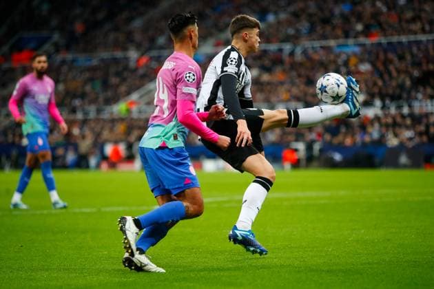 13th December 2023; St James Park, Newcastle, England; UEFA Champions League Football, Newcastle United versus AC Milan; Lewis Miley of Newcastle United controls the ball in the box under pressure from Tijjani Reijnders of AC Milan  ActionPlus12585535 GrahamxWilson