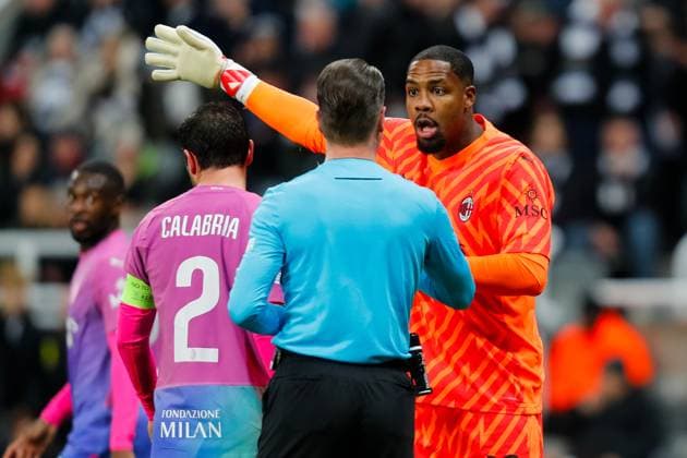 13th December 2023; St James Park, Newcastle, England; UEFA Champions League Football, Newcastle United versus AC Milan; Mike Maignan of AC Milan protests to Referee Danny Makkelie after he is booked  ActionPlus12585543 GrahamxWilson