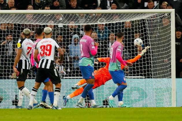 13th December 2023; St James Park, Newcastle, England; UEFA Champions League Football, Newcastle United versus AC Milan; Mike Maignan of AC Milan dives to save a shot from Bruno Guimaraes of Newcastle United  ActionPlus12585553 GrahamxWilson