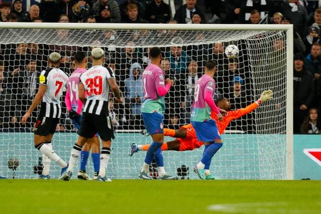 13th December 2023; St James Park, Newcastle, England; UEFA Champions League Football, Newcastle United versus AC Milan; Mike Maignan of AC Milan dives to save a shot from Bruno Guimaraes of Newcastle United  ActionPlus12585554 GrahamxWilson
