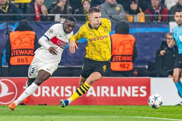 Randal Kolo Muani Paris Saint Germain, 23 Nico Schlotterbeck Borussia Dortmund, 4 Borussia Dortmund vs Paris Saint Germain, Football, UEFA Champions League, Matchday 6, 13 12 2023 DFL REGULATIONS PROHIBIT ANY OUSE OF PHOTOGRAPHS AS IMAGE SEQUENCES AND OR QUASI VIDEO Borussia Dortmund vs Paris Saint Germain, Football, UEFA Champions League, Matchday 6, 13 12 2023 Dortmund Copyright: xEibner-Pressefoto BahhoxKarax EP_BVB