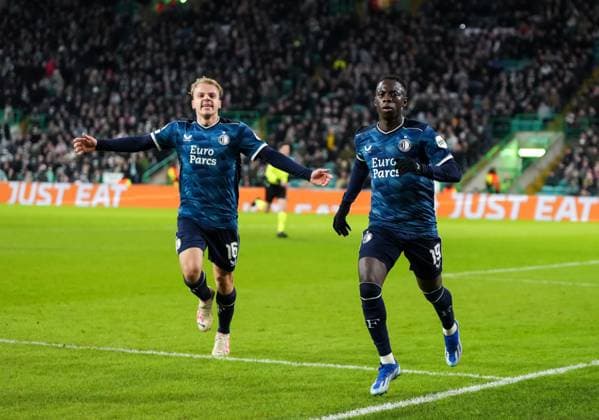 Yankuba Minteh of Feyenoord celebrates scoring to tie the game 1-1, with Thomas van den Belt of Feyenoord, left. Celtic v Feyenoord, UEFA Champions League, Group E, Football, Celtic Park, Glasgow, UK - 13 Dec 2023 EDITORIAL USE ONLY No use with unauthorised audio, video, data, fixture lists, club league logos or live services. Online in-match use limited to 120 images, no video emulation. No use in betting, games or single club league player publications.  Copyright: xStuartxWallace Shutterstockx 14254242ar