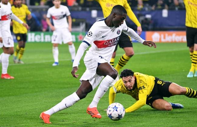 Football, Champions League, Germany, Men, Season 2023 2024, Matchday 6, Signal Iduna Park Dortmund Bor Dortmund FC Paris Saint Germain Randal Kolo Muani PSG , Ramy Bensebaini BVB Action UEFA REGULATES PROHIBIT ANY USE OF PHOTOGRAPHS AS IMAGE SEQUENCES AND OR QUASI VIDEO