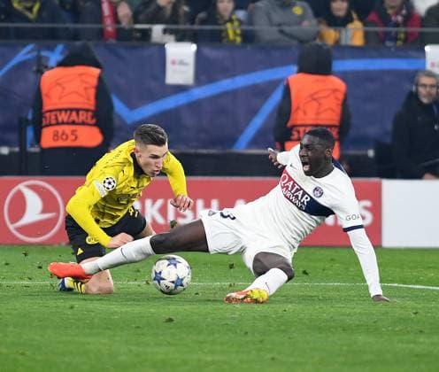 13 12 2023, Dortmund, Germany, Signal Iduna Park, Borussia Dortmund vs Paris Saint Germain UEFA Champions League 2023 2024 Group F, Nico Schlotterbeck Borussia Dortmund and Randal Kolo Muani Paris Saint Germain in a duel Photo Ralf Treese Dortmund Signal Iduna Park North Rhine Westphalia Germany 521_BVBPSG20231213_046 Treese-521