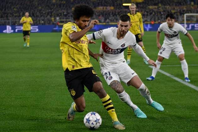 from left in duel Karim Adeyemi 27, Borussia Dortmund Lucas Hernandez 21, Paris Saint Germain 13 12 2023 Soccer, Champions League, Borussia Dortmund vs Paris St Germain, Signal Iduna Park, Dortmund, NRW Germany Copyright: xpepphotox xHorstxMauelshagenx pep00321, pep_20231213_hm