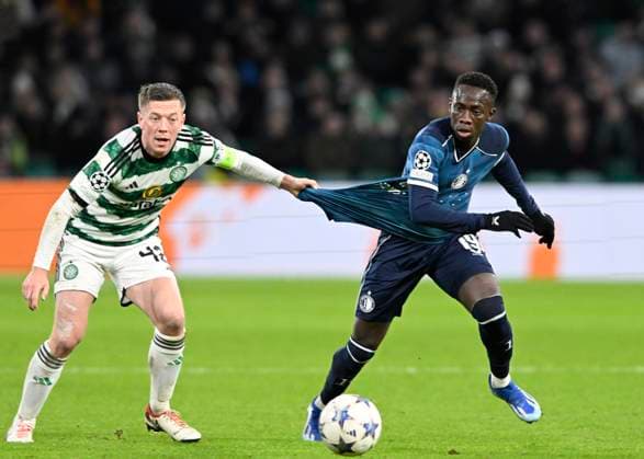 Glasgow, Scotland, 13th December 2023. Callum McGregor of Celtic and Yankuba Minteh of Feyenoord during the UEFA Champions League match at Celtic Park, Glasgow. Picture credit should read: Neil Hanna Sportimage EDITORIAL USE ONLY. No use with unauthorised audio, video, data, fixture lists, club league logos or live services. Online in-match use limited to 120 images, no video emulation. No use in betting, games or single club league player publications. SPI-2799-0080