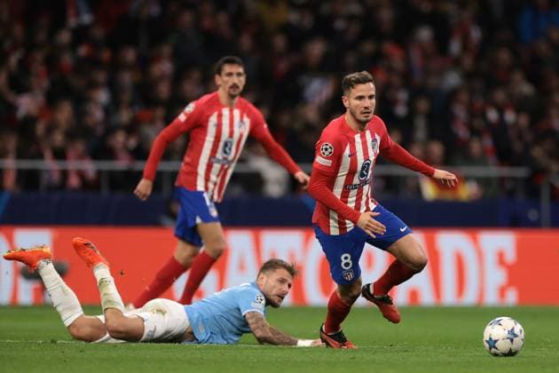Madrid, Spain, 13th December 2023. Stefan Savic of Atletico Madrid looks on as team mate Saul Niguez clashes with Ciro Immobile of SS Lazio during the UEFA Champions League match at Civitas Metropolitan Stadium, Madrid. Picture credit should read: Jonathan Moscrop Sportimage EDITORIAL USE ONLY. No use with unauthorised audio, video, data, fixture lists, club league logos or live services. Online in-match use limited to 120 images, no video emulation. No use in betting, games or single club league player publications. SPI-2787-0088