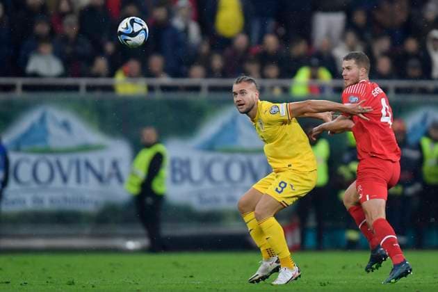 Romania V Switzerland - UEFA EURO, EM, Europameisterschaft,Fussball 2024 European Qualifiers George Puscas and Nico Elvedi in action during the UEFA EURO 2024 European Qualifiers match between Romania and Switzerland at Arena Nationala in Bucharest, Romania, on November 21, 2023. Bucharest Romania  Copyright: xAlexxNicodimx originalFilename:nicodim-romaniav231121_npv01.jpg