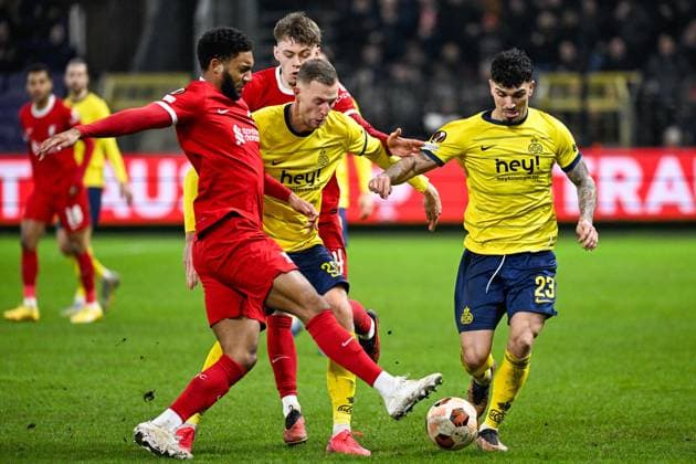 Liverpool s Joe Gomez, Union s Gustaf Nilsson and Union s Cameron Puertas Castro fight for the ball during a game between Belgian soccer team Royale Union Saint Gilloise and English club Liverpool FC, on Thursday 14 December 2023 in Brussels, on the sixth and last day of the group phase of the UEFA Europa League competition, in group E. LAURIExDIEFFEMBACQ  x82342480x