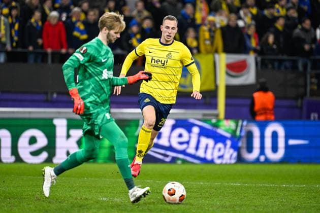 Liverpool s goalkeeper Caoimhin Kelleher and Union s Gustaf Nilsson fight for the ball during a game between Belgian soccer team Royale Union Saint Gilloise and English club Liverpool FC, on Thursday 14 December 2023 in Brussels, on the sixth and last day of the group phase of the UEFA Europa League competition, in group E. LAURIExDIEFFEMBACQ  x82342644x