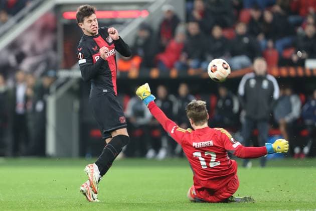 Germany, Leverkusen, 14 12 2023, BayArena, Bayer Leverkusen vs Molde FK UEFA Europa League 2023 2024 Group H, Adam Hlozek Bayer 04 Leverkusen and goalkeeper Oliver Petersen Molde FK battle for the ball Leverkusen BayArena North Rhine Westfalia Germany eu-images-678